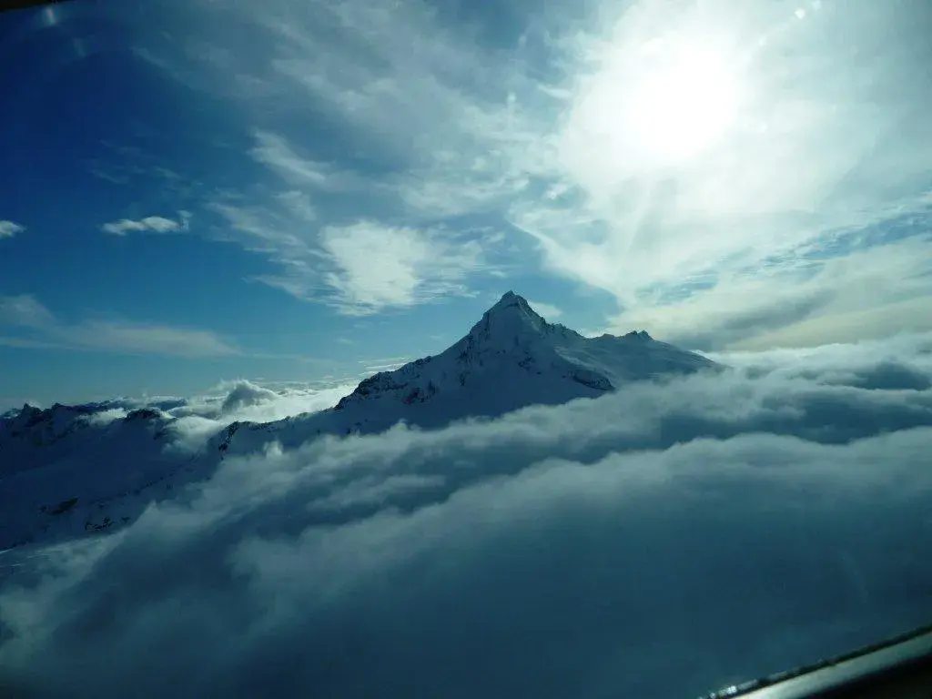 Mount Aspiring rising above the cloud · Michael and Lesley · UK · October 2011