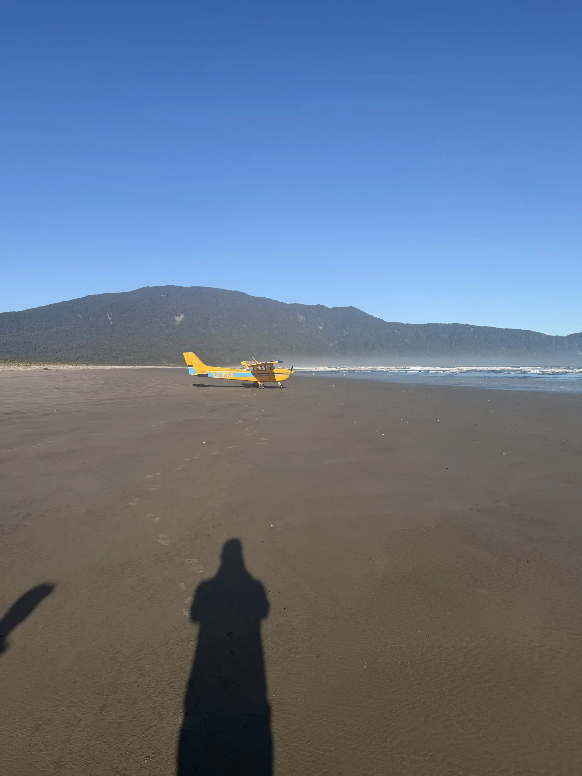 Flyinn Cessna 172 parked on the beach at Big Bay