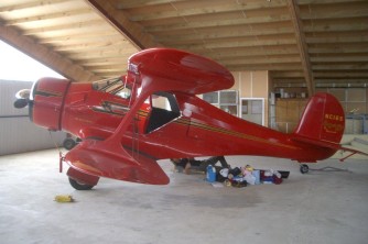 Minor adjustments after full restoration2. Beech Staggerwing NC16S at Mandeville. Gerard and Karen. Mar 08